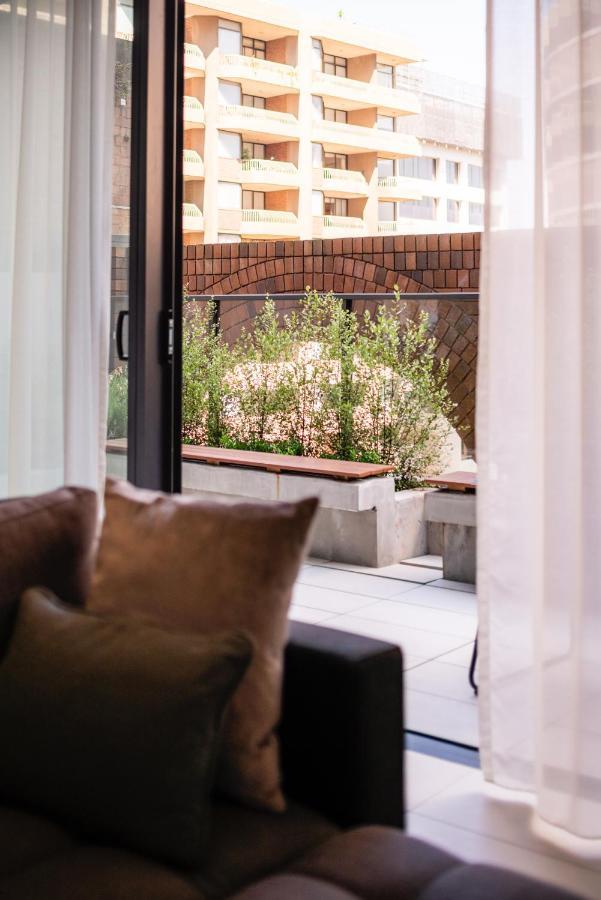 Skye Suites Sydney Exterior photo A view of the garden from the living room